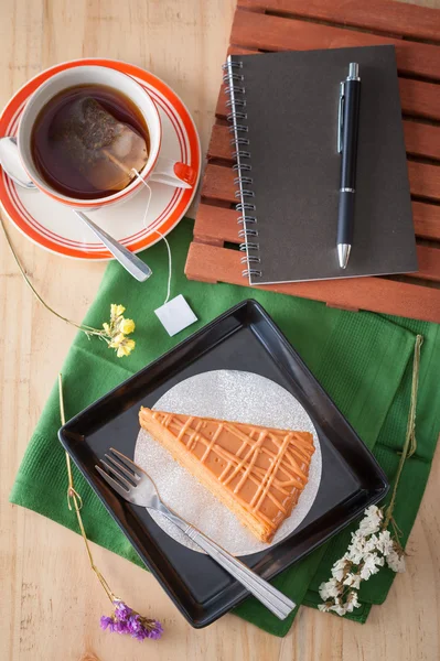 Thai tea cake with notepad — Stock Photo, Image