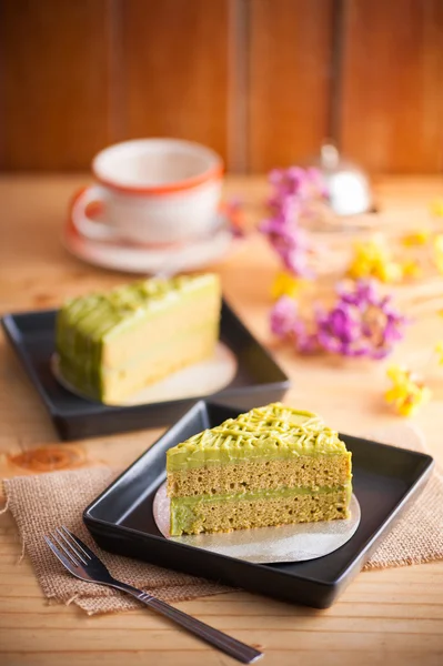 Green tea cake on wood table — Stock Photo, Image