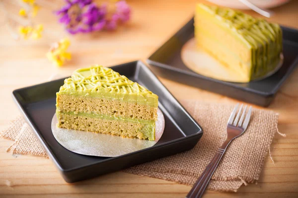 Green tea cake on wood table — Stock Photo, Image