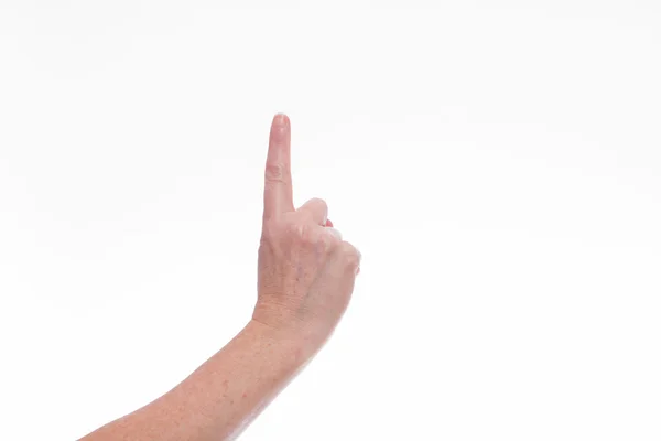 Female hand with index finger pointing up. — Stock Photo, Image