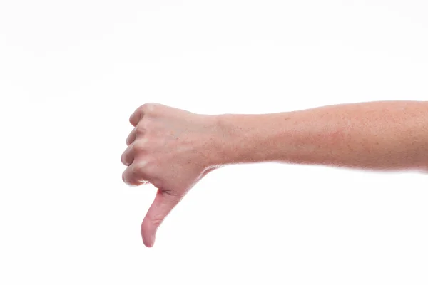 Weibliche Hand macht eine Daumen-nach-unten-Geste. — Stockfoto