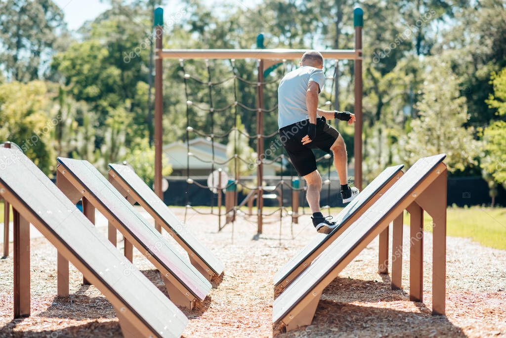 Quintuple Steps jumps, cross fit and ninja training course outside.