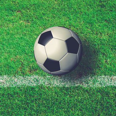 Yukarıdan gelen yeşil çim sahada futbol topu