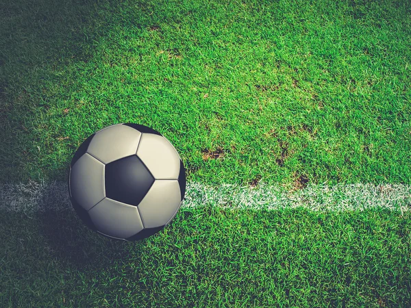 Football ( soccer ball ) in green grass field. — Stock Photo, Image