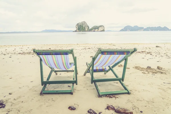 Beach chairs and beautiful beach (Vintage filter effect used) — Stock Photo, Image