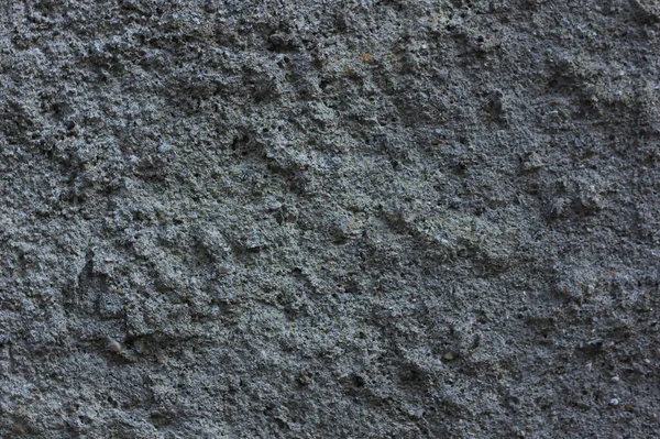 Donmuş çimentoyla harmanlanmış gri beton bir duvarın arka planı 