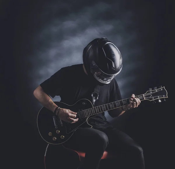 Man Motorcycle Helmet Playing Electric Guitar Dark Background — Stock Photo, Image