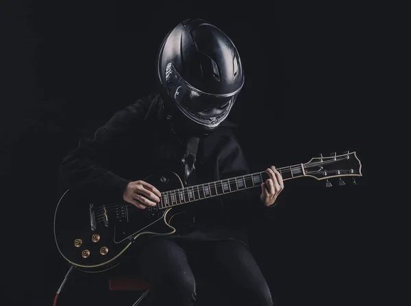 Girl Black Sweatshirt Motorcycle Helmet Plays Electric Guitar Dark Background — Stock Photo, Image