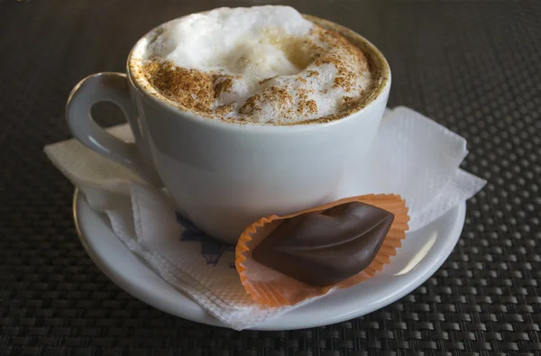 Cup of cappuccino with chocolate lips — Stock Photo, Image