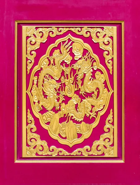 Golden dragon carved decorated on red wooden door, Chinese style in Chinese temple,Thailand. — Stock Photo, Image