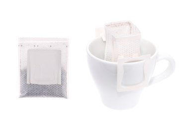 Drip bag coffee hanging on a coffee cup isolated on white background. clipart