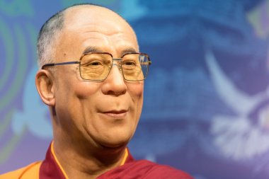 Waxwork of Dalai Lama on display at Madame Tussauds  clipart