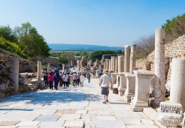 A group of tourists in Ephesus Turkey on April 13, 2015. Ephesus contains the ancient largest collection of Roman ruins in the eastern Mediterranean
