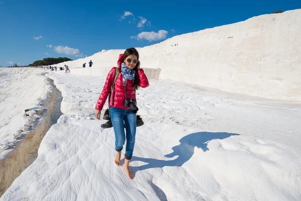 PAMUKKALE, TURKEY- APRIL,12: Tourists on Pamukkale travertines on April 12, 2015 in Pamukkale, Turkey. Pamukkale, UNESCO world heritage site, nowadays become one of the most visited sights in Turkey.