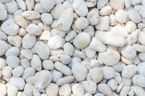 White pebble on the small zen garden ground. Decoration material