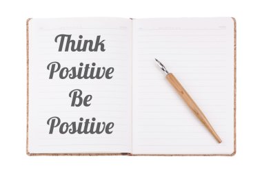 The Positive & Motivational Quote written on a vintage notebook 