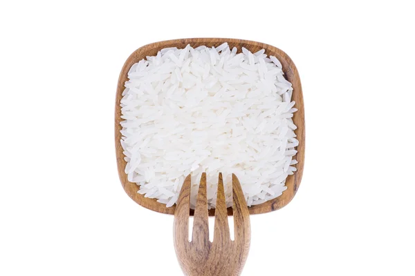 Garpu alami kayu dengan nasi dalam mangkuk kayu kecil — Stok Foto