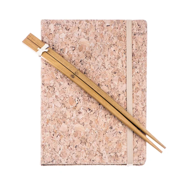 Vintage cork diary book and wooden chopsticks on white background — Stock Photo, Image