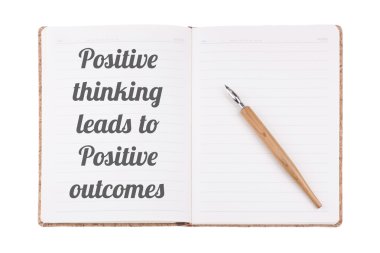 The Positive & Motivational Quote written on a vintage notebook 