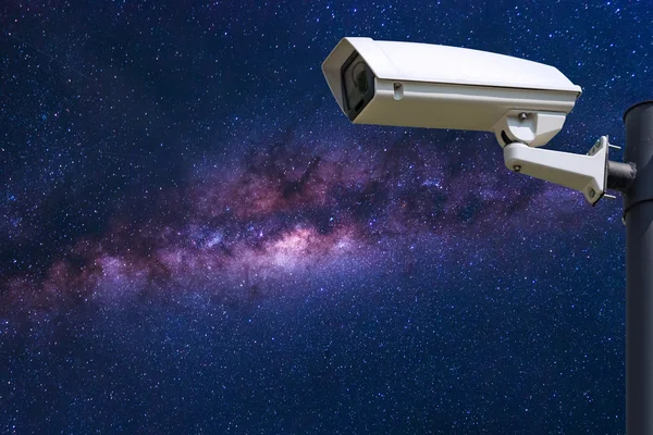 Single CCTV Security camera on milky way galaxy background — стокове фото