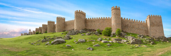 Авила / Испания - 05 12 2021: Majestic panoramic view of Avila city Walls & fortress, full around view at the medieval historic city
