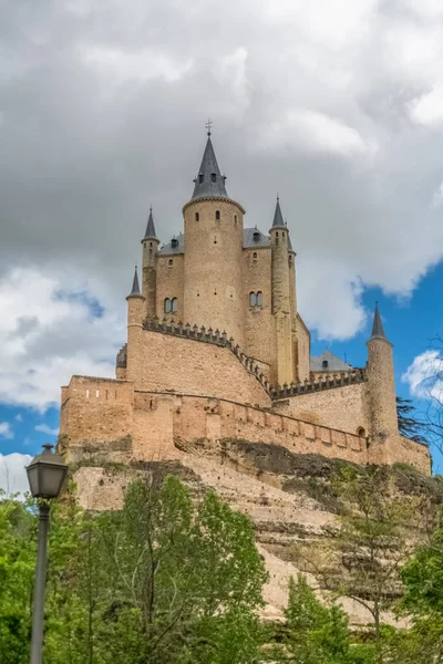 stock image Segovia / Spain - 05 13 2021: Majestic detailed front view at the iconic spanish medieval castle palace Alcazar of Segovia