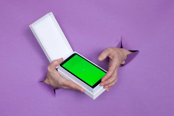 New Smartphone Green Screen Package Purple Background Girl Holds Her — Stock Photo, Image