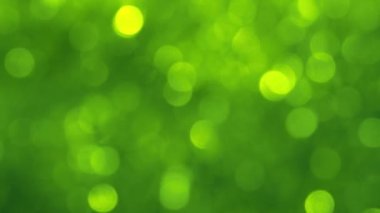 Bokeh efektli bulanık ışıkların yeşil soyut arkaplanı