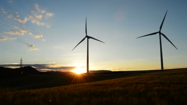 Wind turbines moving at Sunset — Stock Video