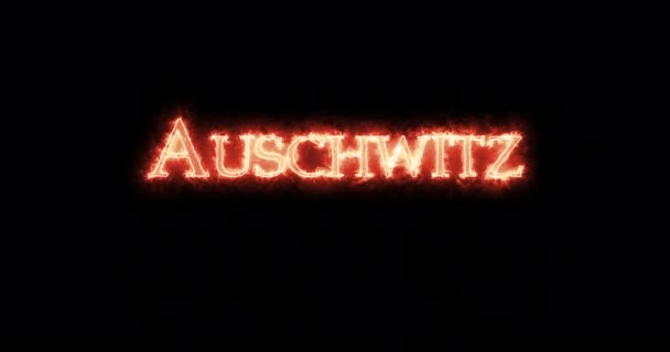 Auschwitz Escrito Con Fuego Bucle — Vídeos de Stock