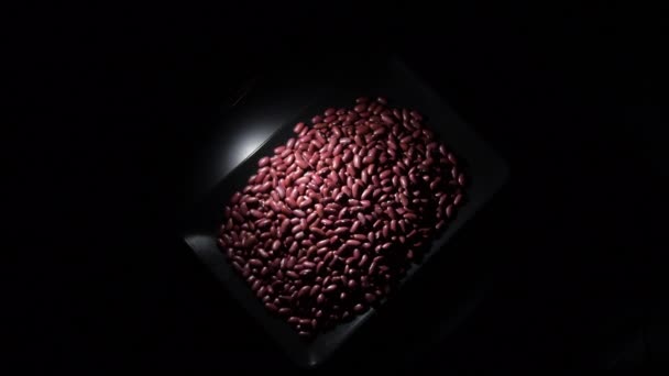 Red Beans Black Tray Turning — Stock Video