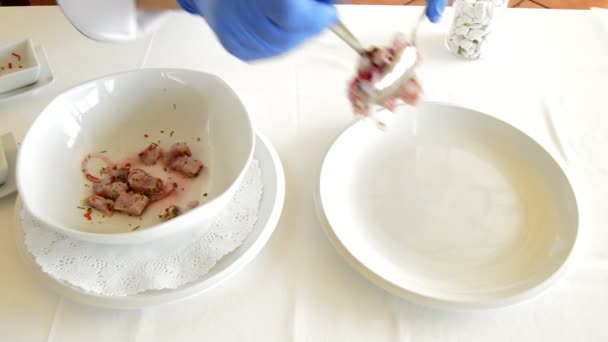 Chef decorating a dish of ceviche — Stock Video
