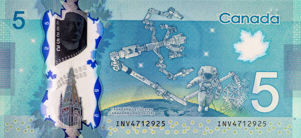 5 Dollars Canada, 2013 with the image of Dextre and canadarm2. International Space Station. Polymer money of Canada.