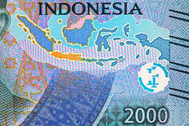 Tasarım için banknotun bir parçasıyla birlikte 2000 Rupiah Endonezya. Endonezya 'nın yeni parası.