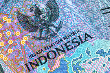 Tasarım için banknotun bir parçasıyla birlikte 2000 Rupiah Endonezya. Endonezya 'nın yeni parası.