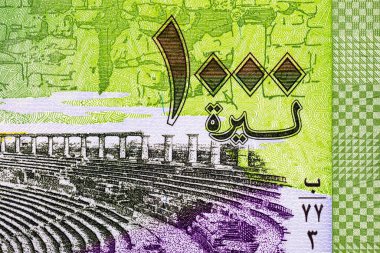 Bosra 'da antik bir Roma tiyatrosu olan Bosra Amfitiyatrosu' nun resmine sahip 1000 Pound Suriye. Suriye 'nin parası.