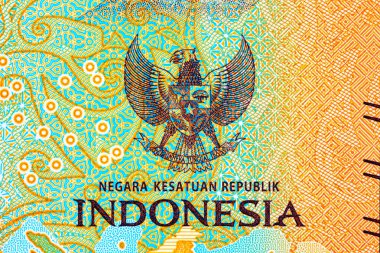 Tasarım için banknotun bir parçasıyla birlikte 5000 Rupiah Endonezya. Endonezya 'nın yeni parası.