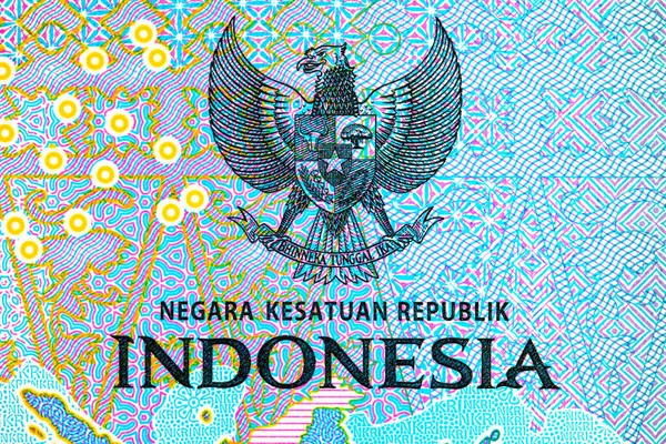 Tasarım için banknotun bir parçasıyla birlikte 2000 Rupiah Endonezya. Endonezya 'nın yeni parası.