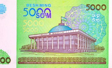 Taşkent 'teki Ulusal Meclis' in (Oliy Majlis) görüntüsüne sahip 5000 Sum Özbekistan. Özbekistan 'ın kağıt parası