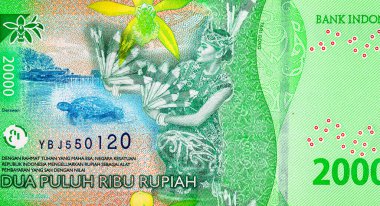 20.000 Rupiah Endonezya 'da Derawan Gölü kıyısında Tari Gong dansı yapan bir kadın resmi. Endonezya 'nın yeni parası.