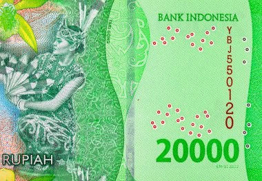 20.000 Rupiah Endonezya 'da Derawan Gölü kıyısında Tari Gong dansı yapan bir kadın resmi. Endonezya 'nın yeni parası.