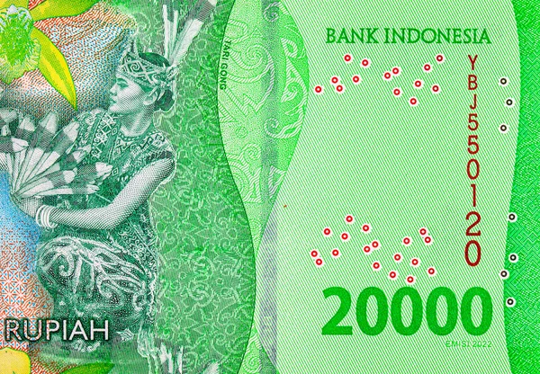 20.000 Rupiah Endonezya 'da Derawan Gölü kıyısında Tari Gong dansı yapan bir kadın resmi. Endonezya 'nın yeni parası.