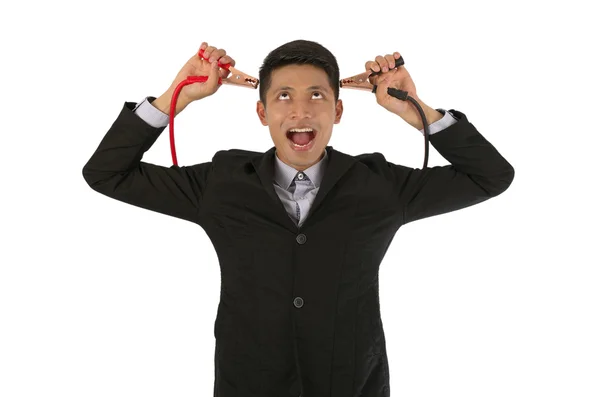 Businessman charging the brain Stock Picture