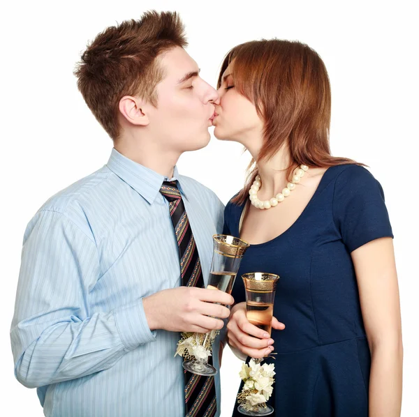 Young couple in love kiss, celebrating a date — Stock Photo, Image