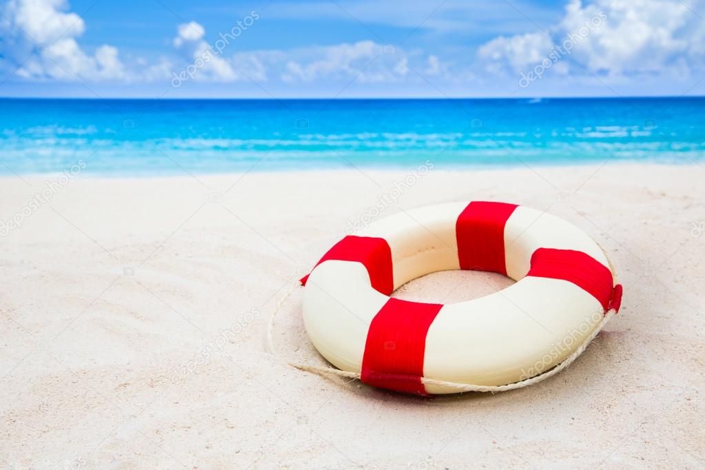 Life buoy on sand