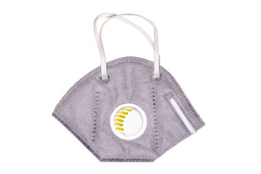 Coronavirus koruyucu önlemleri. Beyaz arka planda izole edilmiş, FFP3 koruma sınıfının yarısını filtreleyen bir N95 yüz maskesi ya da parçacık filtresi. Pandemik önleme. Makro fotoğraf.