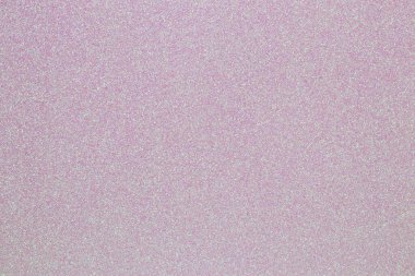 Pembe parıltı dokusu. Açık pembe arka planda pembe parıltılı yakın plan. Makro.