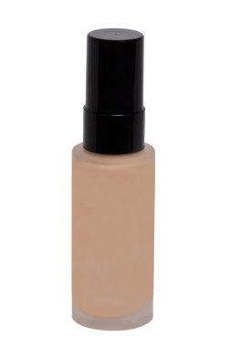 Kozmetik vakfı izole edilmiş. Beyaz arka planda sıvı deri temeli olan kapalı bir cam şişenin yakın çekimi. Nemlendirici ve toner kremi konsepti. Makro.