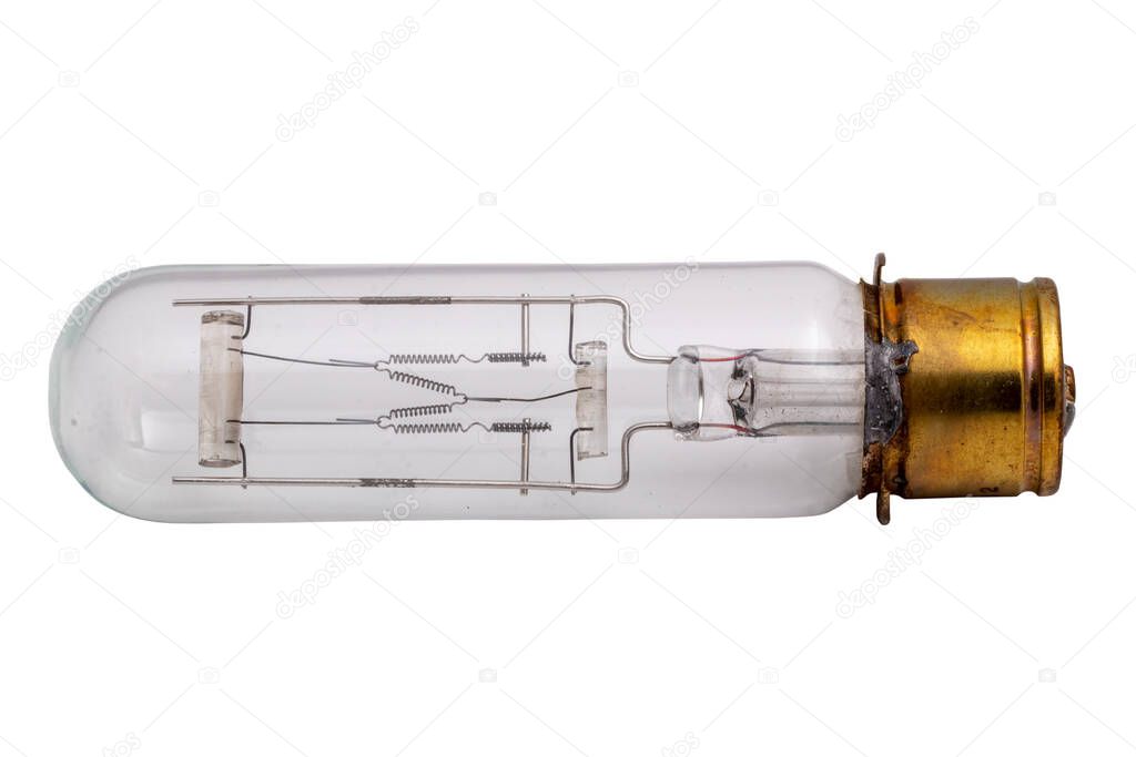 Close-up of a used antique technically advanced narrow film or projection lamp with high luminous flux and small lamp body dimensions. Clipping path. Macro. Isolated on white background.
