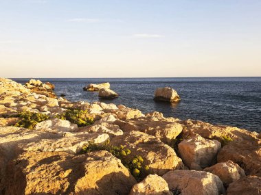 Rocky landscape. Beautiful cliffs on the Costa Blanca in Spain near Arenal Bol and La Fossa beaches at Penon de Ifach rock in Calpe on the Mediterranean Sea.